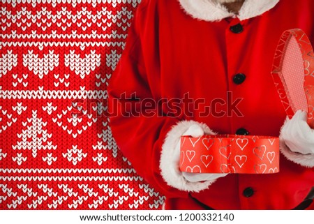 Santa claus opening a gift box against red knitting christmas vector background tree and heart
