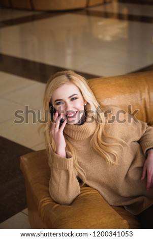 attractive woman have a coffee break using her mobile phone