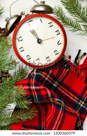 Christmas background with a clock and Christmas tree with a place for the text. Xmas greeting card.