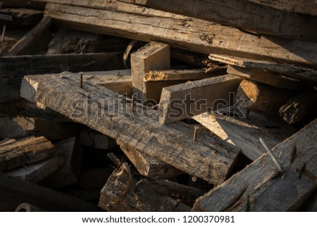 Wood chips with nails Of the building demolition.