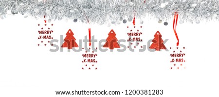 Christmas silver grey garland photo with Merry Christmas label written in red and red trees paper on white background.Banner panoramic
