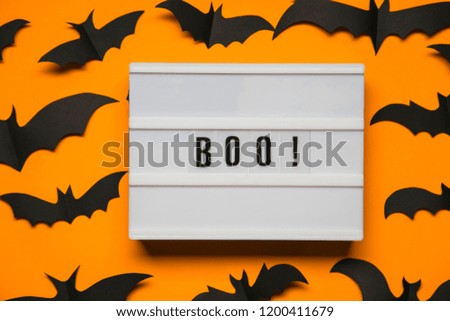 Boo, halloween lightbox message with black scary bats