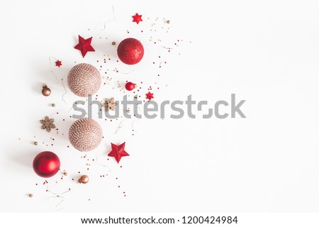 Christmas composition. Christmas red and golden decorations on white background. Flat lay, top view, copy space Royalty-Free Stock Photo #1200424984