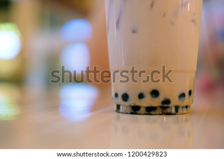 Milk bubble tea in takeaway glass, Homemade Milk Tea with Tapioca Pearls with copy space,  selective focus.