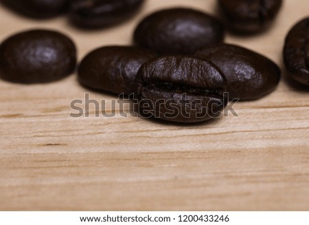 Closeup coffee beans on the wood table