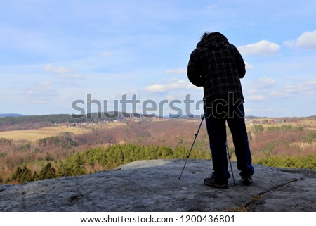 A photographer on the rock. Location: Europe, Czech Republic, Klokocske skaly