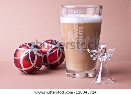 Cup of coffee in the company of Christmas decorations