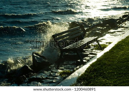 water splash on lakeside bench 