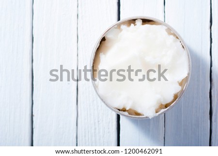 macadamia nut butter cream, skin care product sample on white wooden table