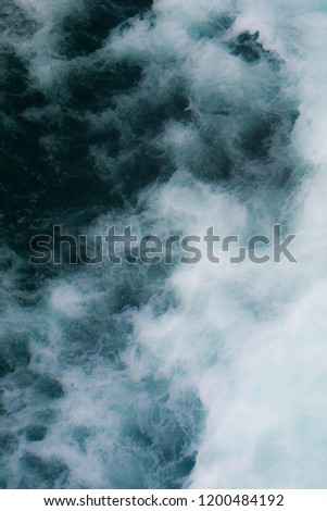Abstract top view on sea waves with soft focus background.