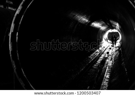 Silhouette pic of worker are working in pressure tube.