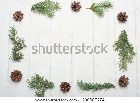 Christmas framework with snow and fir cones on a white background