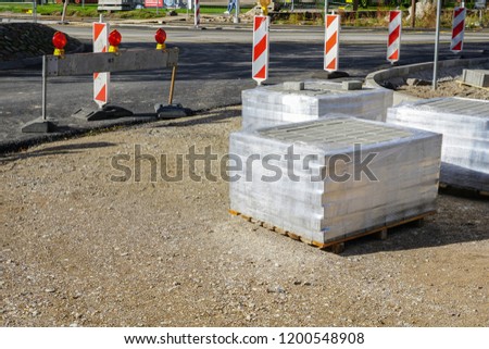 new pavement making with stone blocks in city