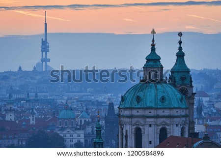  Church tower or dome of temple of the Saint Nicolas church on the Lesser Town in the old part of Prague, Picture taken in the morning before sunrise from Prague castle.                             