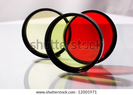 Row of four photo filters with reflection
