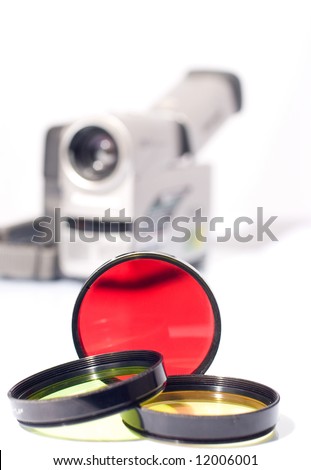 Multi-colored filters and a camcorder on the background