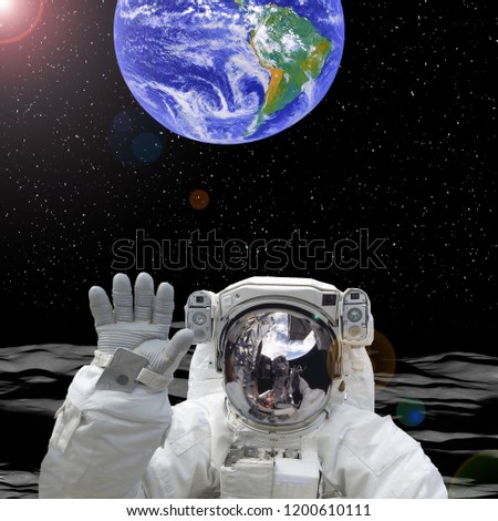 Earth behind the astronaut. Astronaut on the moon. The elements of this image furnished by NASA.
