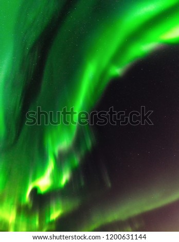 Northern Lights close up high definition photo, very bright green aurora with some magenta nuances, stars shining behind it, north Sweden, no clouds