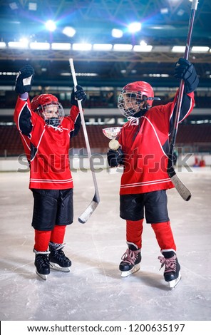 happy youth boys players ice hockey winner trophy
