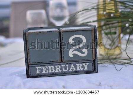 Wood blocks in box with date, day and month 2 February. Wooden blocks calendar