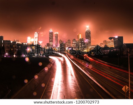 Rainy night in atlanta with red city and highway lights, taken from Jackson Street Bridge