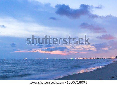 Colorful  clouds  in  the  blue  sky  over  the  sea  and  reflection  at  sun  set  time