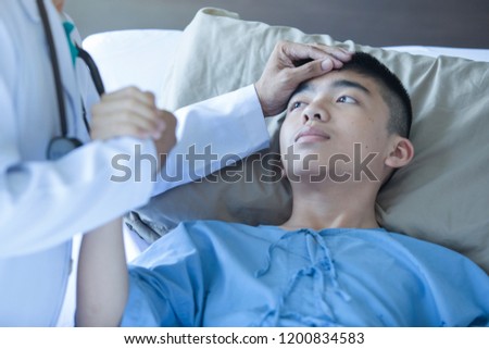 The doctor touches the hands of a patient in a hospital. Close up 