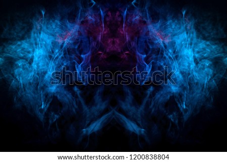 Mocap for cool t-shirts. Cloud of blue smoke  in the form of a  monster, dragon  on a black isolated background. Background from the smoke of vape. 