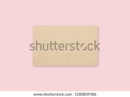 Blank brown business cards on pink background