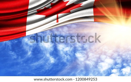 the flag of Canada in the rays sun