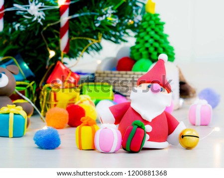 Christmas Carnival of the Blessed and the adornment of the lights at the tree, toys gift boxes and dolls.