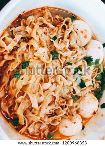 Singapore laska soup noodles with fish ball traditional food Asian cuisine with onion chillies spicy chicken stock 