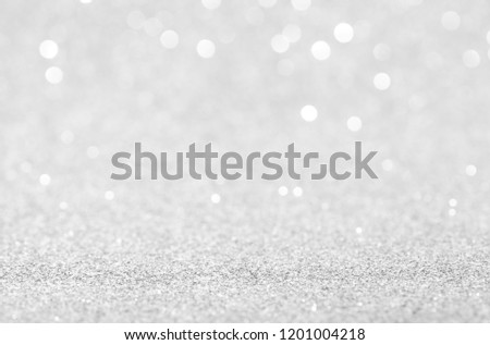 silver and white bokeh lights defocused. christmas abstract background