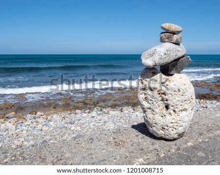 Stone figure staring at the sea, the island of Crete, Greece