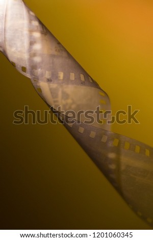 
35 mm film in turn, twisted, gradient background