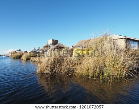 Lake Titicaca straddles the border between Peru and Bolivia in the Andes. It is one of the largest lakes in South America and the highest navigable body of water in the world.