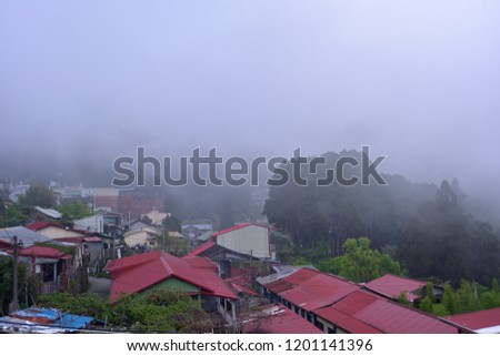 Thick fog Ridge Hood in the village of old houses of nostalgic Japanese wooden red roofs.