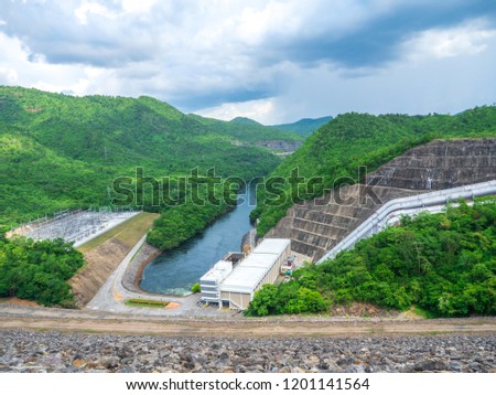 Landscape view of the Srinakarin dam on cloud day and green forest with river in Khuean Srinagarindra National Park at kanchanaburi province of thailand