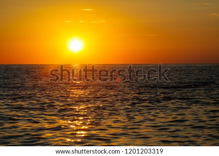 Rays of sunset on the black sea .