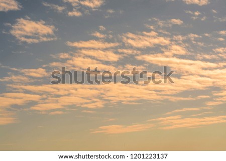Beautiful and gentle evening clouds in the blue sky, texture and background for design.