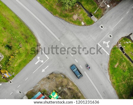 Vehicle in junction from top view by drone