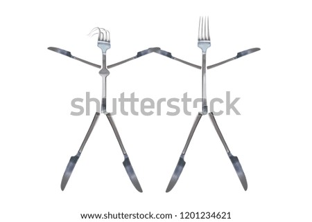 Little dancing girl and man figures made from cutlery. Silver shiny fork and knives. Isolated white background. Cutlery symbol concept design. Copy space