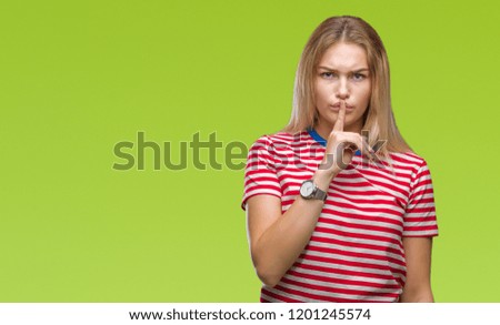 Young caucasian woman over isolated background asking to be quiet with finger on lips. Silence and secret concept.