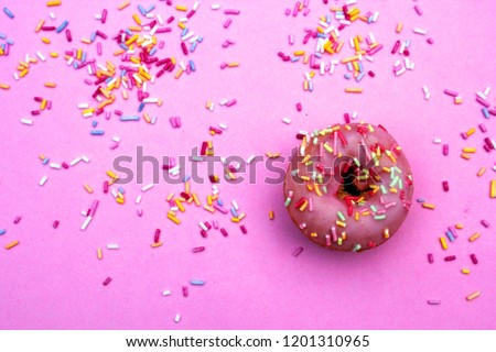 donut donuts icing sprinkles on doughnuts glazed frosting pacific pink bright sugar strands pink donut background 100s and thousands decoration pop art contemporary pink collage - stock photo 