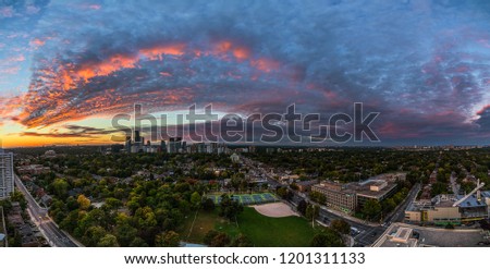 Panoramic view of a sunset over Midtown Toronto from an apartment