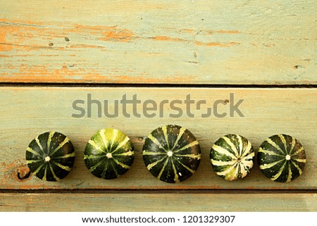 Cluster of beautiful decorative pumpkins on a vintage table  stock photo