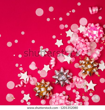 Confetti, bows and paper decorations. Valentines day or birthday party concept theme. Flat lay, top view
