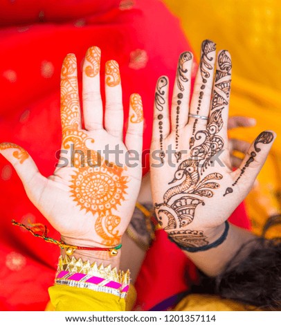 Mehndi Hands of an Indian Bride, tattooed with natural and local dye, Mehndi or Henna. during a Hindu wedding ceremony.