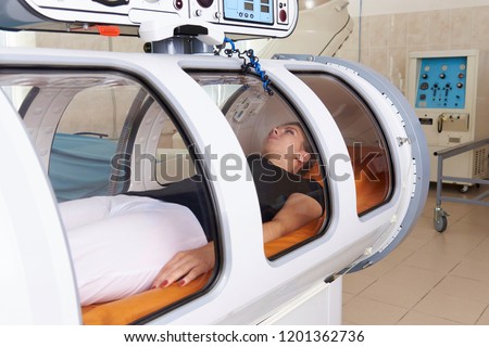 Hyperbaric oxygen chamber in a hospital. Royalty-Free Stock Photo #1201362736