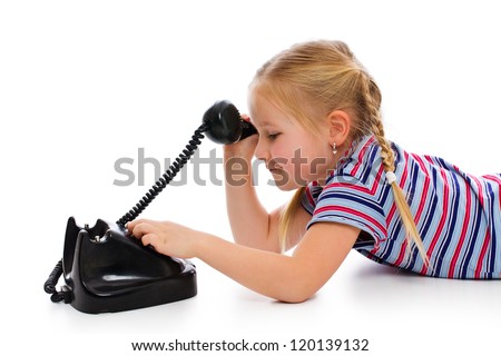 Little girl with old retro phone. Studio shot on white background.
